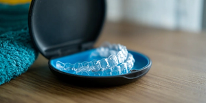 Invisalign clear aligners in a retainer box