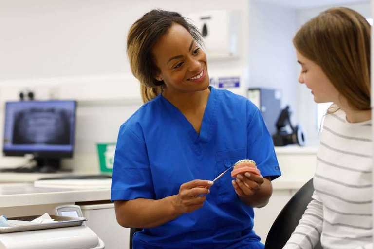 An ortho nurse explaining the treatment process