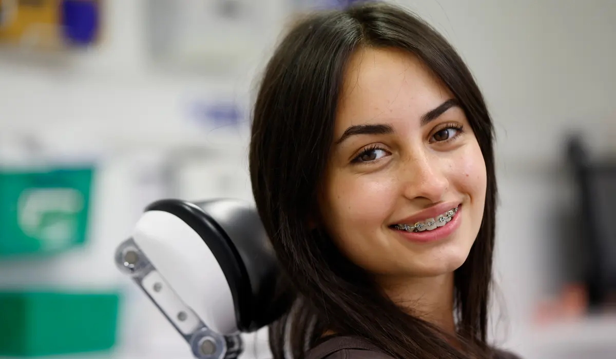Portrait of a smiling teenager with fixed braces