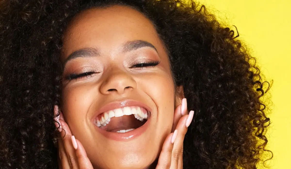 Vividly painted lips with white teeth