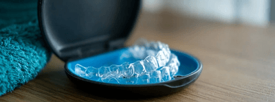 Invisalign clear aligners in a retainer box