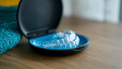 Invisalign clear aligners in a retainer box
