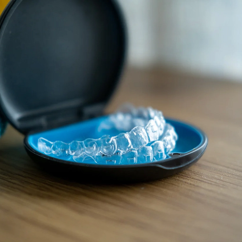 Invisalign retainers in a branded box